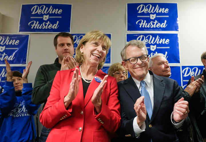 Republican candidate for governor Mike DeWine and his wife Fran applaud during a rally at the Lucas County Republican headquarters in Holland, Ohio.   (Jeremy Wadsworth / The Blade)